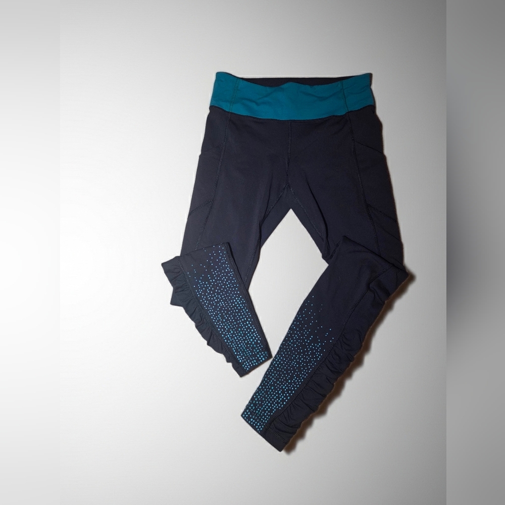 Lululemon Tight Stuff Tight II leggings in the Night Tide color with reflective